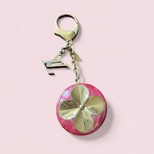 Louis Vuitton Hollow Flower Bag Charm – Fuchsia Resin & Gold-Tone Brass
